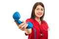 Portrait of doctor wearing scrubs handing telephone receiver Royalty Free Stock Photo