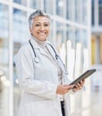 Portrait of doctor, woman and tablet for medical review, data research and healthcare in hospital. Happy female Royalty Free Stock Photo