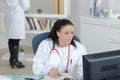 Portrait doctor working at nurses station Royalty Free Stock Photo