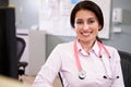 Portrait Of Doctor Working At Nurses Station Royalty Free Stock Photo