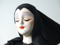 Portrait of doll in black habit