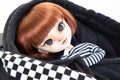 Portrait doll girl in a black fashion child checkered sweat cap Royalty Free Stock Photo