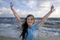 Portrait of down syndrome girl smiling on background of the seaÃÅ½