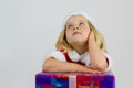 Portrait of a dreamer girl in red new year cap Royalty Free Stock Photo