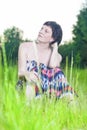 Portrait of Dreaming and Relaxing Caucasian Brunette Woman Posing Outdoors on Nature Background at Sunset Royalty Free Stock Photo