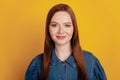 Portrait of dreamy charming lovely lady look camera on yellow background