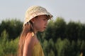 Portrait of dreamy teen girl at summer meadow