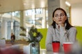 Portrait of dreamy woman in cafe