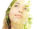 A double exposure portrait of a dreamy young woman looking away from the camera combined with a photo of green leaves Royalty Free Stock Photo