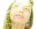 A double exposure portrait of a dreamy young woman looking away from the camera combined with tree leaves Royalty Free Stock Photo