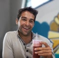 Portrait, drink and smoothie for man with smile for healthy diet of strawberry, fruit and show of beverage. Male person Royalty Free Stock Photo