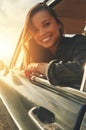 Portrait, driver and road trip with a black woman in a car at sunset during summer vacation or travel. Nature, window