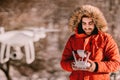 Portrait of drone operator flying quadcopter in winter Royalty Free Stock Photo