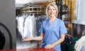 Portrait of dry-cleaning salon worker