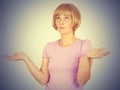 Portrait dumb looking woman arms out shrugs shoulders. Royalty Free Stock Photo
