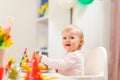 Portrait of eat smeared kid eating birthday cake