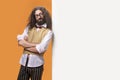 Portrait of an eccentric man posing next to the white board Royalty Free Stock Photo