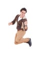 Portrait of ecstatic casual young man jumping with hands raised Royalty Free Stock Photo