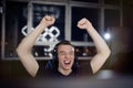 Portrait gamer guy screaming and rejoicing while playing video games on computer