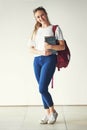 Portrait, education and happy student, textbook and bag ready for college, school or university on campus. Young woman Royalty Free Stock Photo