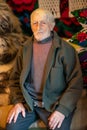 Portrait of an elder man in traditional old home and traditional clothes, Roumania Maramures County