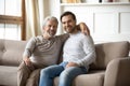 Portrait of elderly father hugging with adult son Royalty Free Stock Photo
