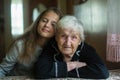 Portrait of elderly grandmother with her little granddaughter. Royalty Free Stock Photo