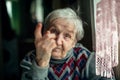 Portrait of an elderly happy woman indignantly wags her finger. Royalty Free Stock Photo