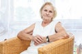 Portrait of an elderly lady sitting in a chair Royalty Free Stock Photo