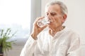 Portrait elderly man drinking water