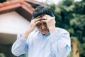 Portrait of an elderly man with headache.senior man covering his face with his hands.vintage tone Royalty Free Stock Photo