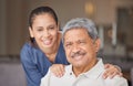 Portrait of elderly man with a nurse, bonding during a checkup at assisted living homecare . Smile, happy and friendly