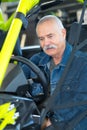 portrait elderly man on off-road-vehicle Royalty Free Stock Photo