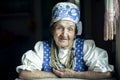 Portrait of an elderly woman in ethnic Russian or Ukrainian clothes.