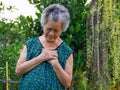 Portrait of elderly woman having heart attack Royalty Free Stock Photo