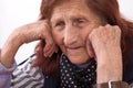 Portrait of an elderly woman with sad face expression Royalty Free Stock Photo