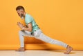 oga man. Man doing yoga on a yellow background