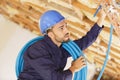 portrait electrician fitting cables at site