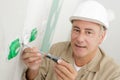 portrait electrician installing socket in new house Royalty Free Stock Photo