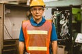 Portrait electrician male worker. electricity engineer man at high voltage circuit cabinet. technician at circuit breaker power
