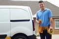 Portrait Of Electrician With Van Outside House Royalty Free Stock Photo