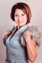 Portrait of elegant lady in evening dress and fur collar standing Royalty Free Stock Photo