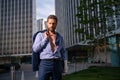 Portrait of an elegant sexy man. Man model in suit and unbuttoned shirt outdoor. Ambitions concept and success business.