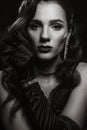 Portrait of an elegant woman in vintage retro style of black and white Hollywood movies with makeup and hairstyle. Royalty Free Stock Photo