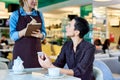 Businesswoman Ordering Lunch in Cafe