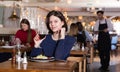 Young lady with glass of wine in restaurant Royalty Free Stock Photo