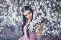 Portrait of an elf in a blooming garden Royalty Free Stock Photo