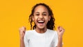 Portrait of emotional black girl screaming with raised fists Royalty Free Stock Photo