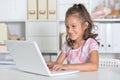 Portrait of emotional cute girl using laptop Royalty Free Stock Photo