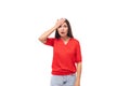 portrait of emotional cute young european brunette lady in red t-shirt on white background with copy space Royalty Free Stock Photo